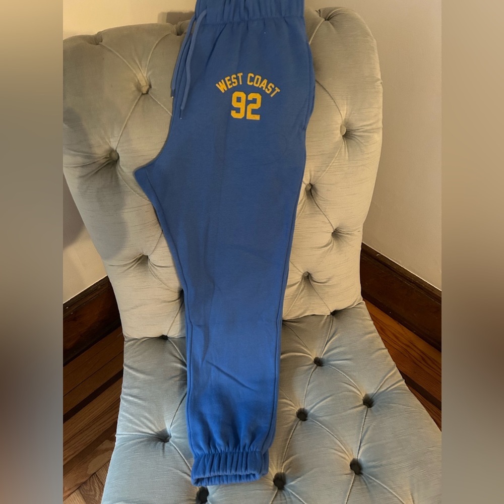 Blue sweatpants size Medium with pockets. West Coast 92. New without tags.